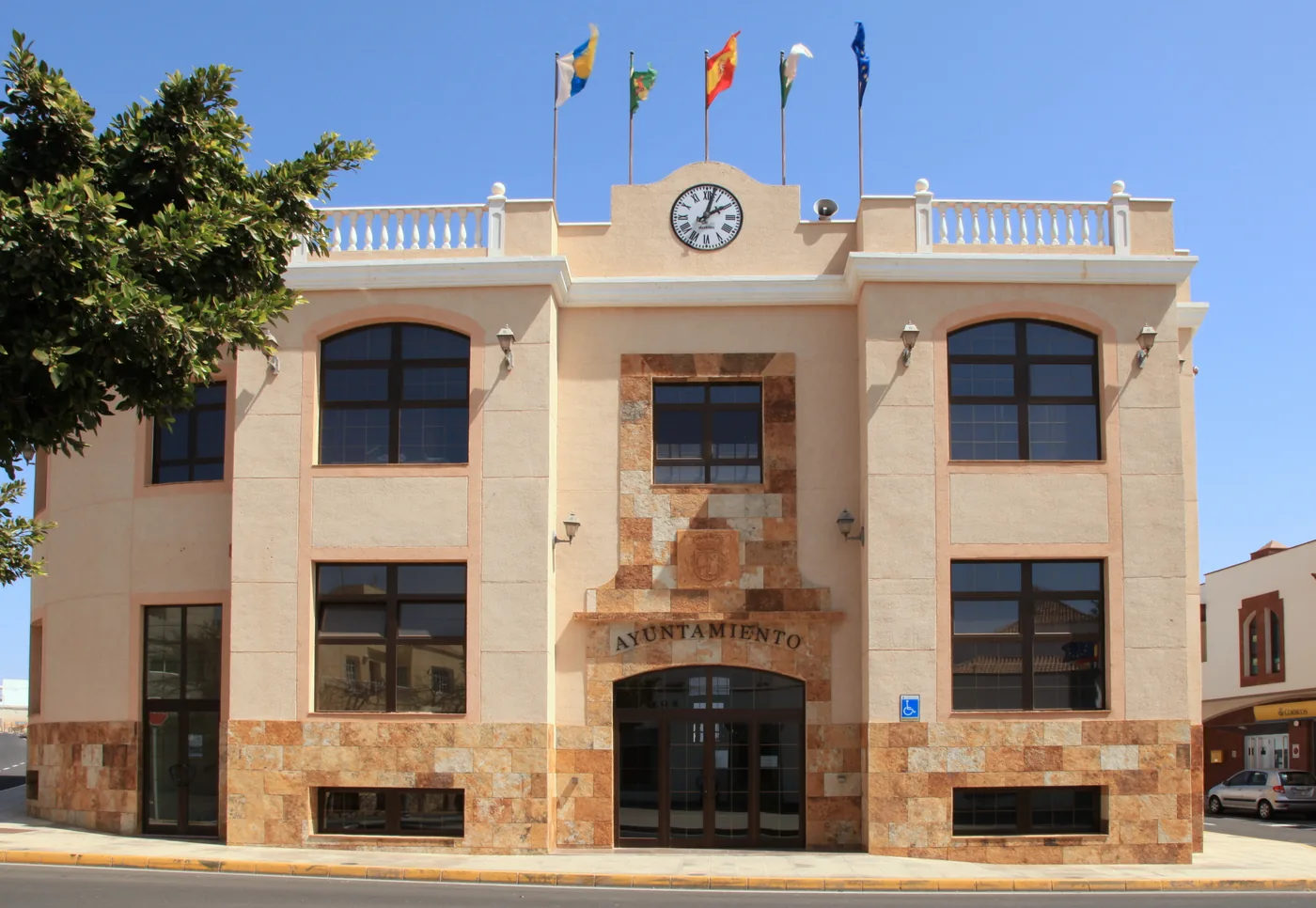 The town hall of Antigua with its clock and flags, Fuerteventura.