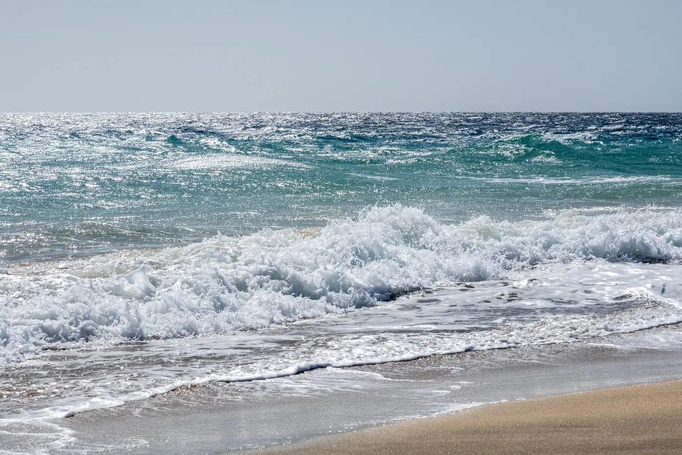 Surf breaking on Playa del Matorral, Morro Jable