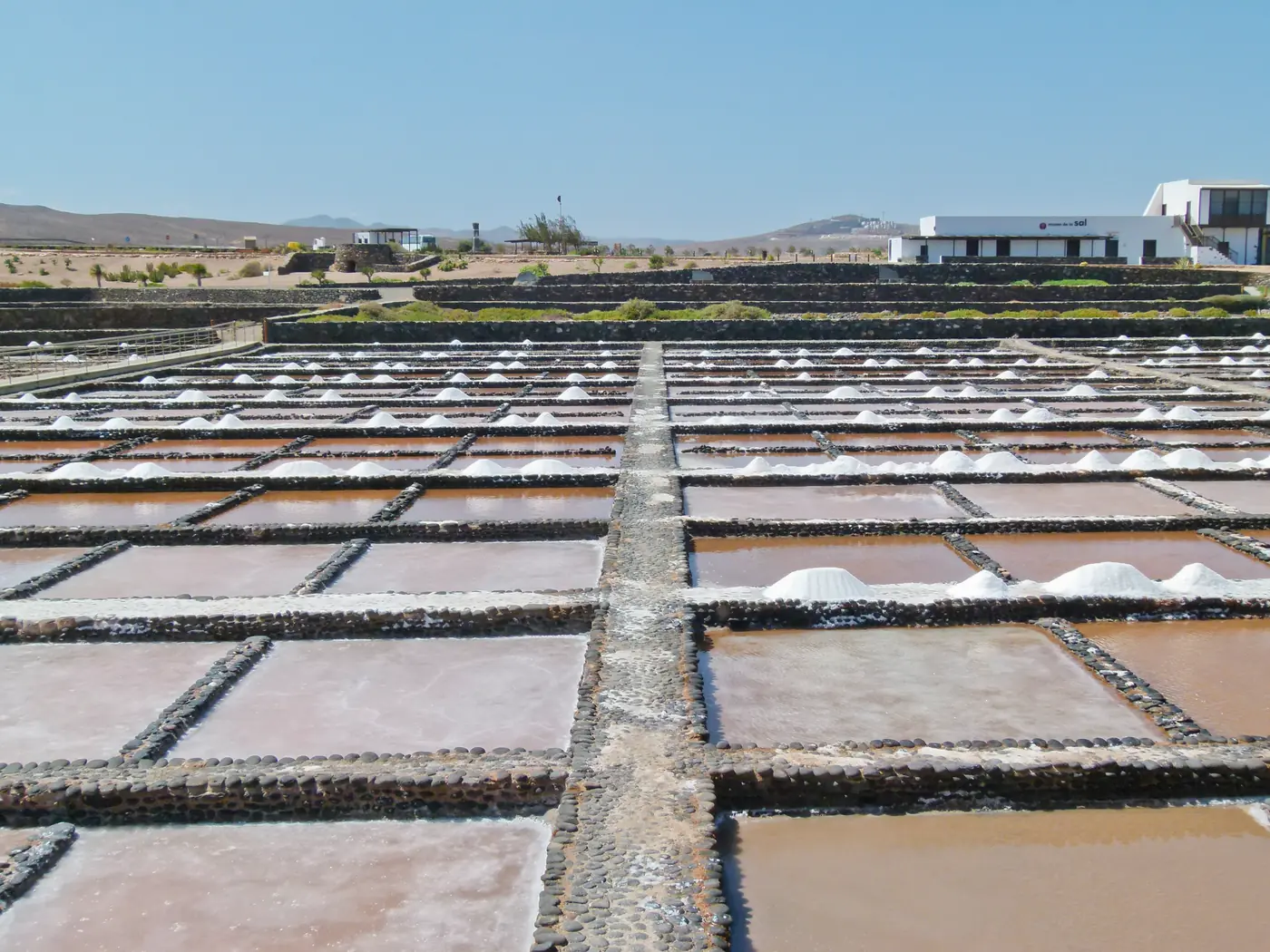 The pans of Salinas del Carmen with heaps of salt on the coast of Fuerteventura.