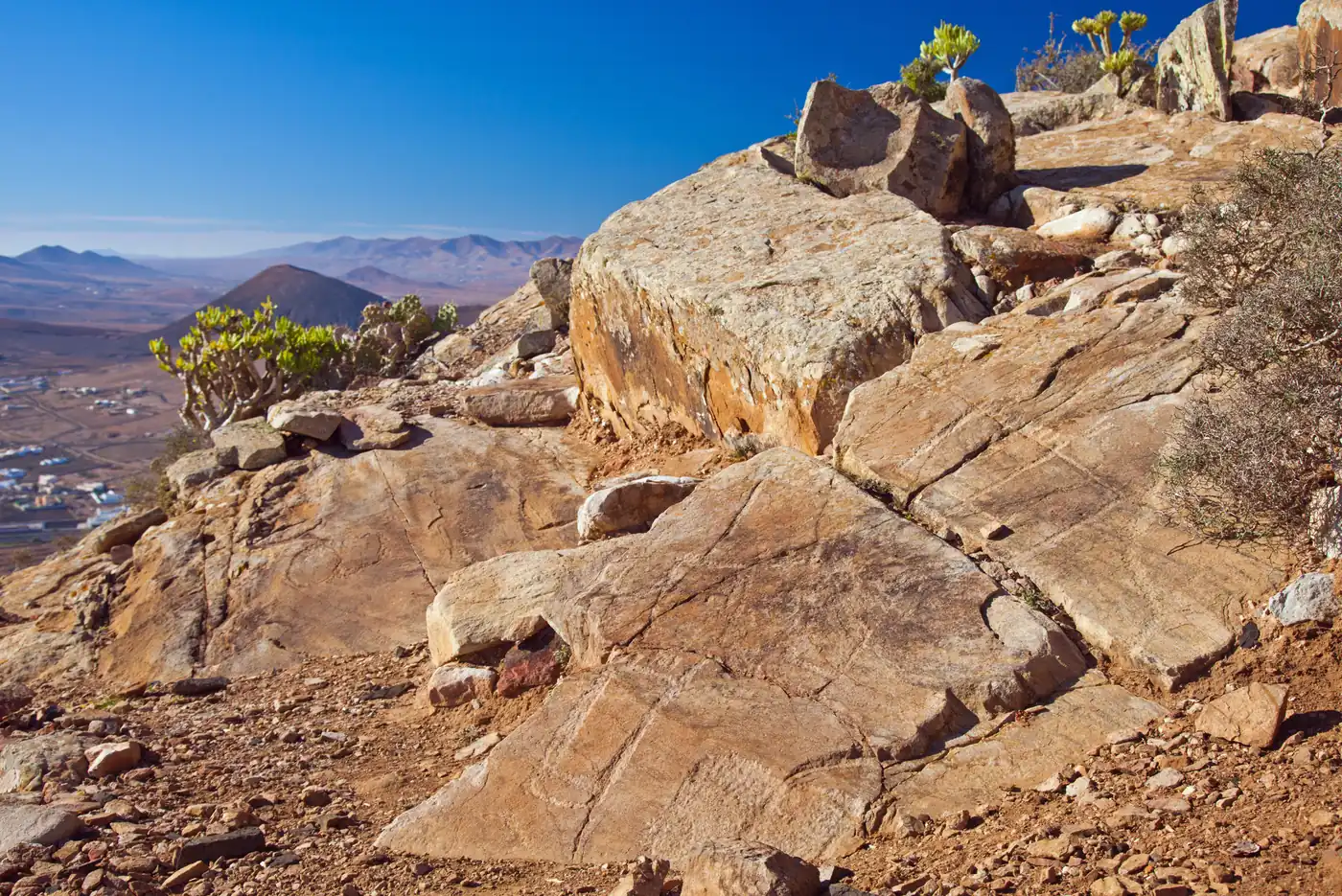 Foot-shaped engravings, the podomorphs, on the rock of Tindaya mountain